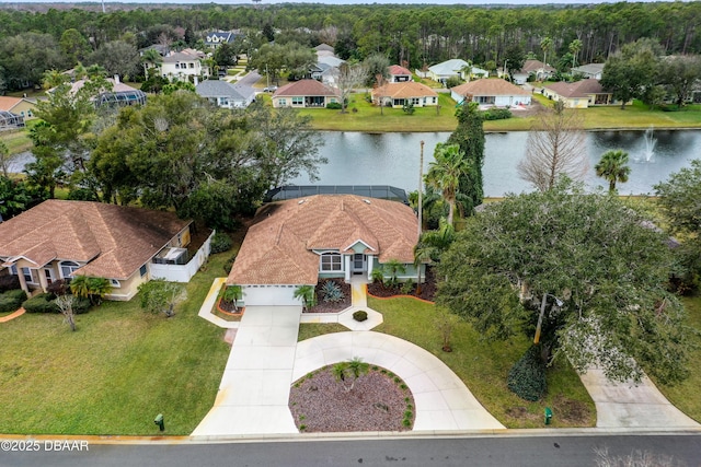 birds eye view of property featuring a residential view and a water view