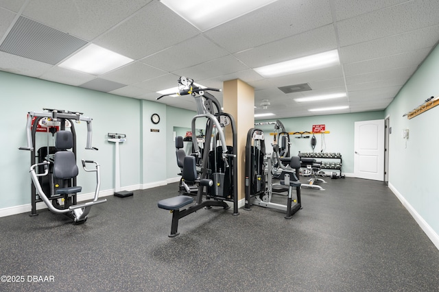 gym featuring a drop ceiling