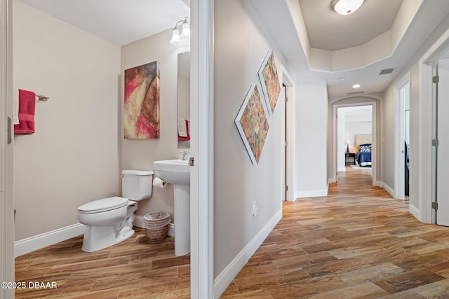 3737 S Atlantic Ave Unit 702, Daytona Beach, FL 32118 - hallway featuring wood finished floors and arched walkways