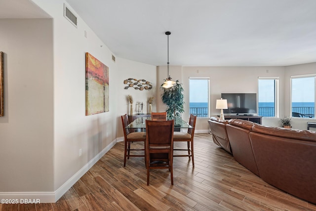 3737 S Atlantic Ave Unit 702, Daytona Beach, FL 32118 - dining space with wood finished floors and healthy amount of natural light