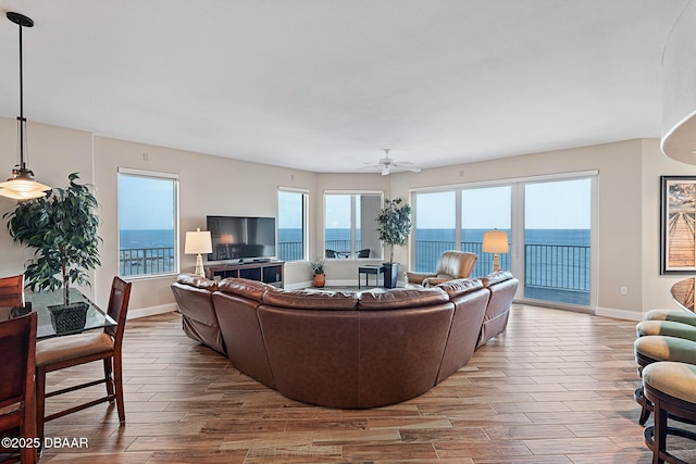 3737 S Atlantic Ave Unit 702, Daytona Beach, FL 32118 - living room featuring wood finished floors and a ceiling fan