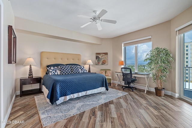 3737 S Atlantic Ave Unit 702, Daytona Beach, FL 32118 - bedroom with wood finished floors, multiple windows, and a ceiling fan
