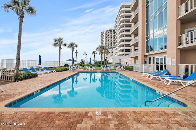 3737 S Atlantic Ave Unit 702, Daytona Beach, FL 32118 - community pool featuring a patio area