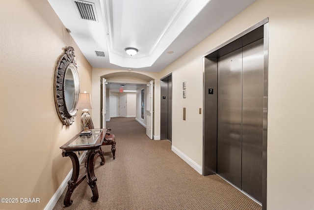 3737 S Atlantic Ave Unit 702, Daytona Beach, FL 32118 - corridor featuring elevator, carpet, arched walkways, and a raised ceiling