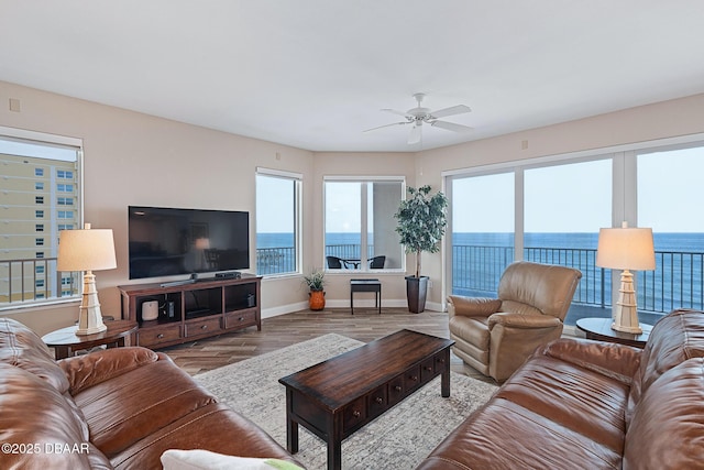 3737 S Atlantic Ave Unit 702, Daytona Beach, FL 32118 - living room featuring a ceiling fan and wood finished floors