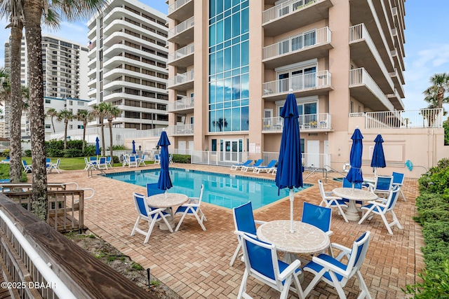 3737 S Atlantic Ave Unit 702, Daytona Beach, FL 32118 - community pool featuring a patio