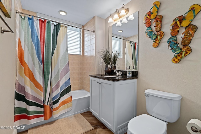 3737 S Atlantic Ave Unit 702, Daytona Beach, FL 32118 - full bathroom with vanity, shower / tub combo with curtain, and wood finished floors