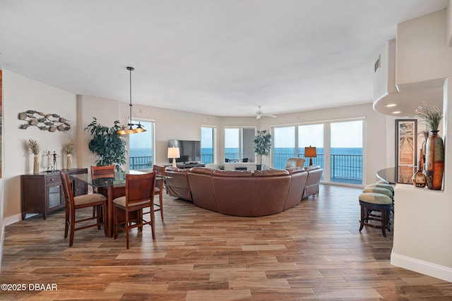 3737 S Atlantic Ave Unit 702, Daytona Beach, FL 32118 - living room featuring wood finished floors and baseboards