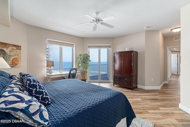 3737 S Atlantic Ave Unit 702, Daytona Beach, FL 32118 - bedroom featuring access to exterior, light wood-style floors, and ceiling fan