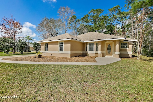 view of front facade with a front lawn and stucco siding