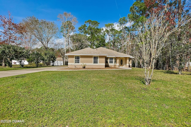 single story home with stucco siding, driveway, and a front lawn