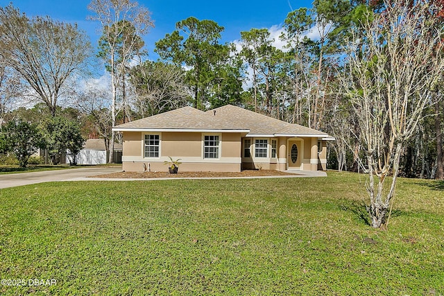 single story home with stucco siding, driveway, a front lawn, and roof with shingles