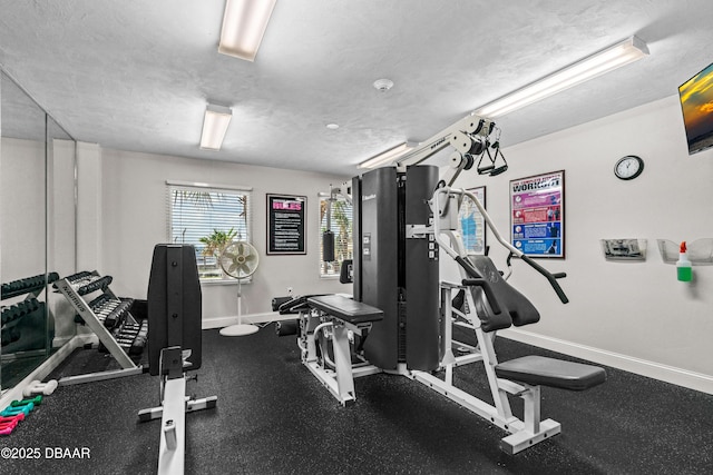 3333 S Atlantic Ave Unit 1802, Daytona Beach, FL 32118 - gym with baseboards and a textured ceiling