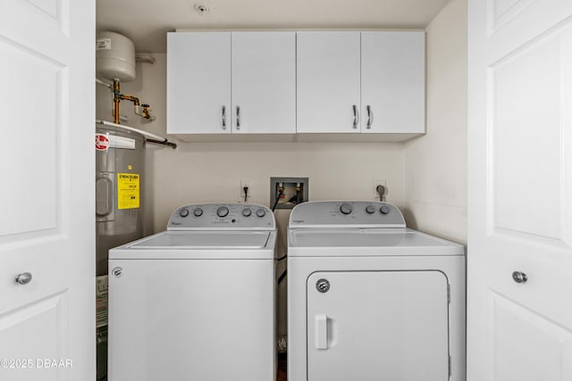 3333 S Atlantic Ave Unit 1802, Daytona Beach, FL 32118 - laundry room with cabinet space, washing machine and dryer, and electric water heater