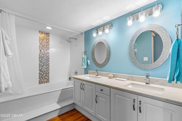 3333 S Atlantic Ave Unit 1802, Daytona Beach, FL 32118 - bathroom featuring shower / bath combination with curtain, double vanity, recessed lighting, and wood finished floors