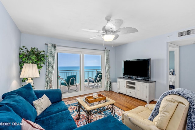 3333 S Atlantic Ave Unit 1802, Daytona Beach, FL 32118 - living area with light wood finished floors and a ceiling fan