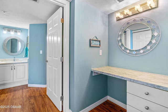 3333 S Atlantic Ave Unit 1802, Daytona Beach, FL 32118 - bathroom with wood finished floors, vanity, and a chandelier