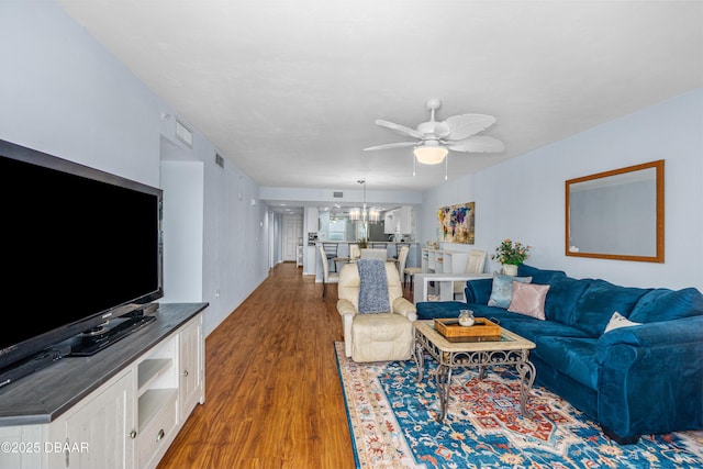 3333 S Atlantic Ave Unit 1802, Daytona Beach, FL 32118 - living room with a chandelier, wood finished floors, and ceiling fan