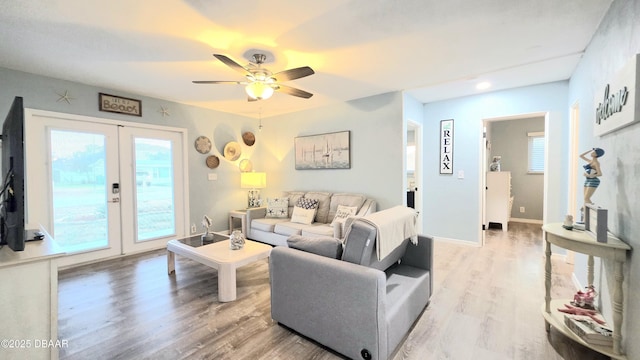 8 Tarpon Ave, Ormond Beach, FL 32176 - living area featuring french doors, light wood-type flooring, ceiling fan, and baseboards