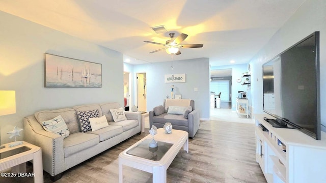 8 Tarpon Ave, Ormond Beach, FL 32176 - living area featuring a ceiling fan and light wood finished floors