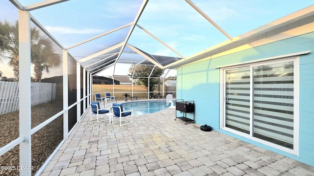 8 Tarpon Ave, Ormond Beach, FL 32176 - view of patio featuring glass enclosure and a fenced backyard