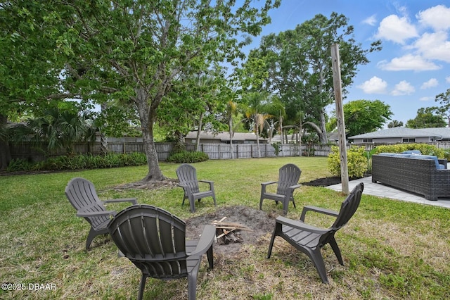 view of yard featuring a fire pit and a patio area