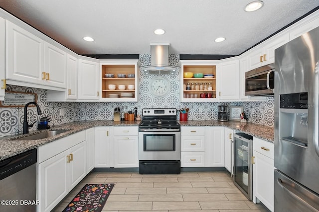 kitchen with stainless steel appliances, open shelves, a sink, ventilation hood, and recessed lighting