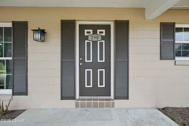 doorway to property with a porch