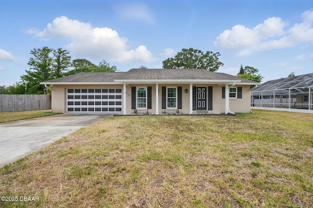 ranch-style home with an attached garage, driveway, and covered porch