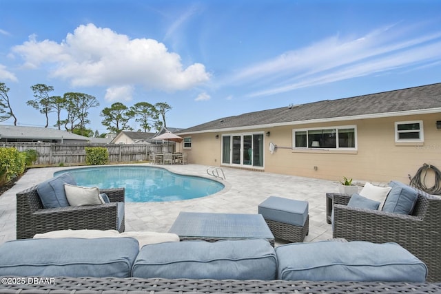 view of pool with an outdoor hangout area, a fenced backyard, and a patio area