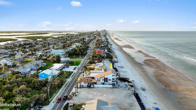 drone / aerial view with a view of the beach and a water view