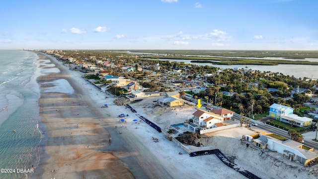 birds eye view of property featuring a view of the beach and a water view