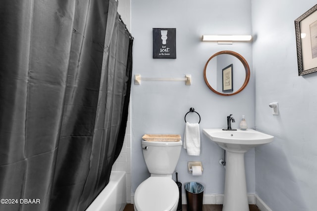 full bathroom featuring shower / bath combo, sink, and toilet