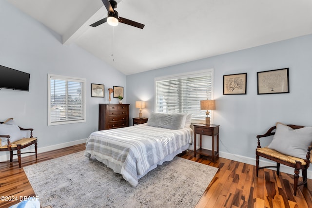 bedroom with hardwood / wood-style flooring, ceiling fan, and vaulted ceiling with beams