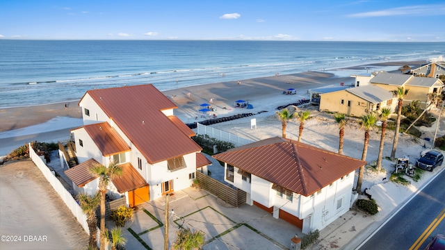 birds eye view of property featuring a view of the beach and a water view