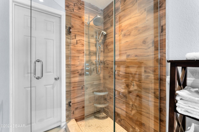 bathroom with walk in shower and tile patterned floors