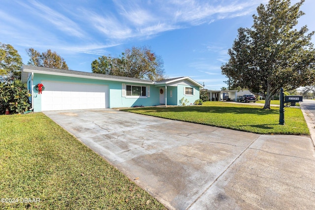 ranch-style home featuring a garage and a front lawn