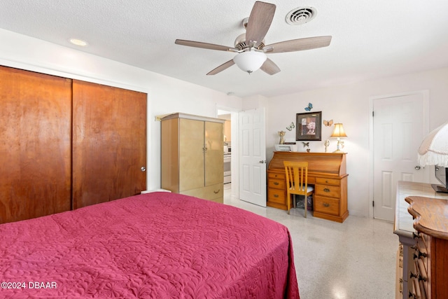 bedroom featuring ceiling fan, a closet, and a textured ceiling