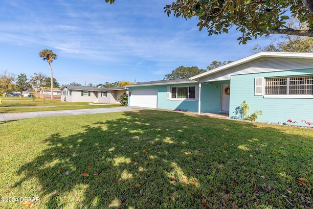 ranch-style house with a garage and a front yard