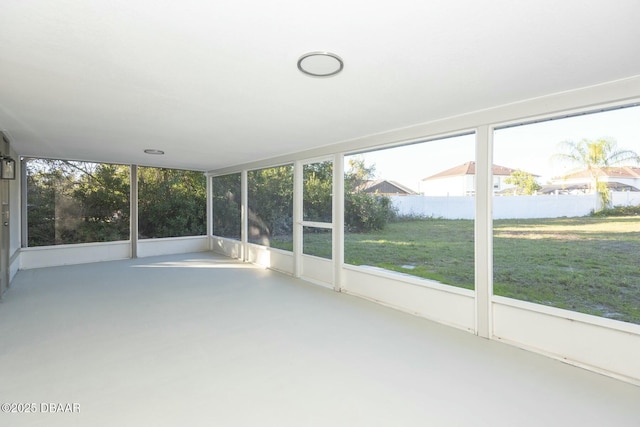 unfurnished sunroom featuring a healthy amount of sunlight