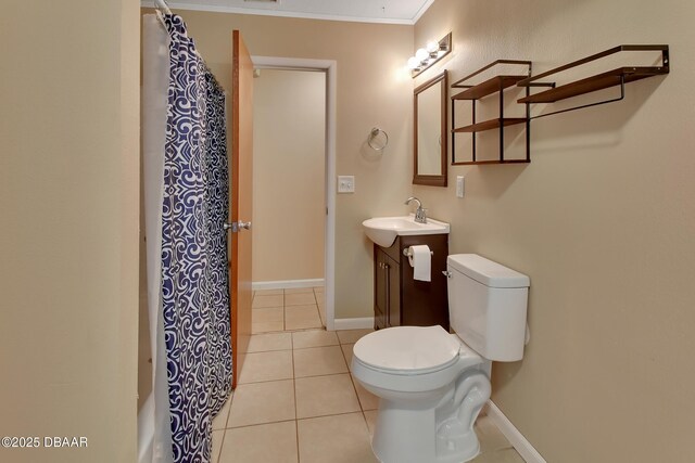 full bath with baseboards, toilet, tile patterned floors, and crown molding