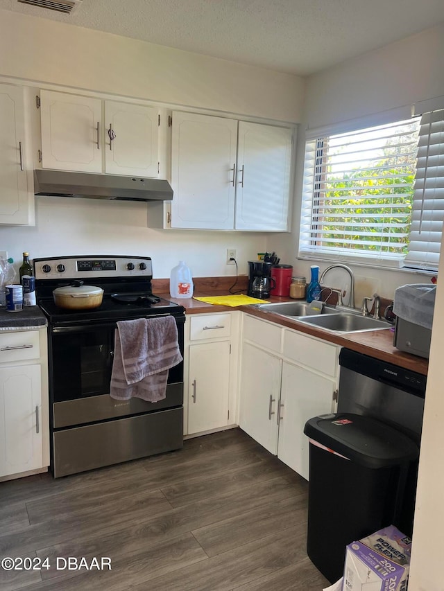 kitchen featuring stainless steel electric range, dark hardwood / wood-style flooring, sink, a textured ceiling, and white cabinetry