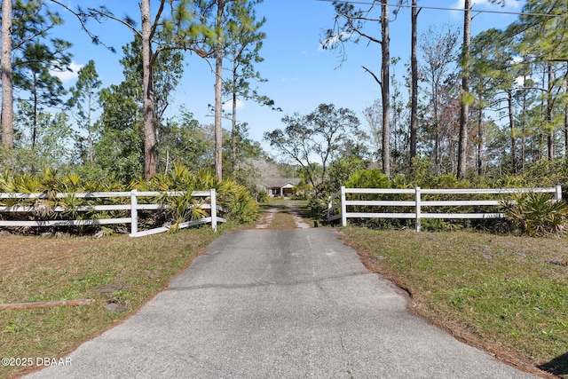 view of gate with fence