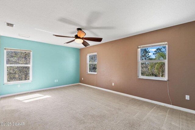 3531 Red Barn Ln, Ormond Beach, FL 32174 - spare room featuring carpet floors, a ceiling fan, and baseboards