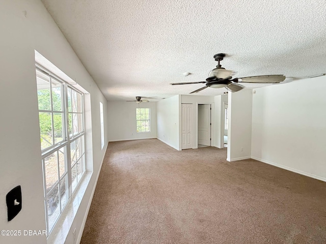 3531 Red Barn Ln, Ormond Beach, FL 32174 - unfurnished room featuring ceiling fan, a textured ceiling, light carpet, and baseboards