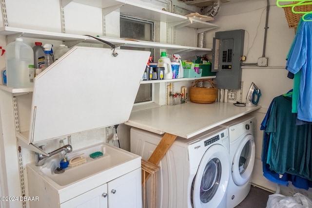 laundry room featuring washer and clothes dryer and electric panel