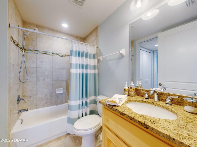 full bathroom featuring tile patterned flooring, shower / bath combo, vanity, and toilet