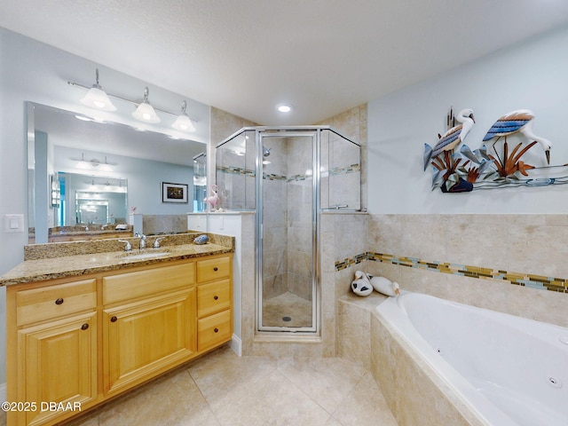 bathroom with separate shower and tub, tile patterned flooring, and vanity