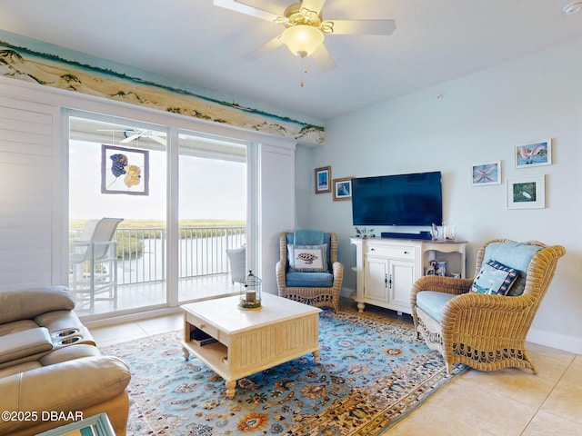 living room with ceiling fan and light tile patterned flooring