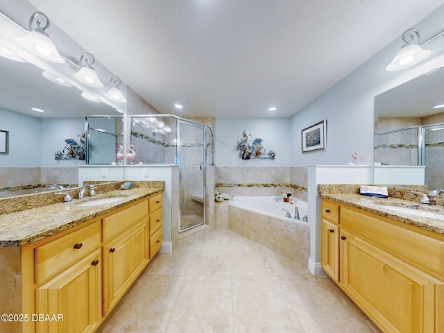 bathroom with plus walk in shower, vanity, and tile patterned floors